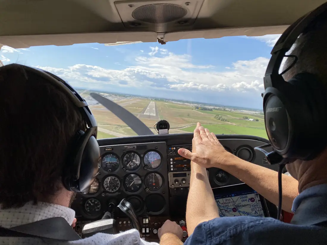 Carl coaching a crosswind approach from the right seat