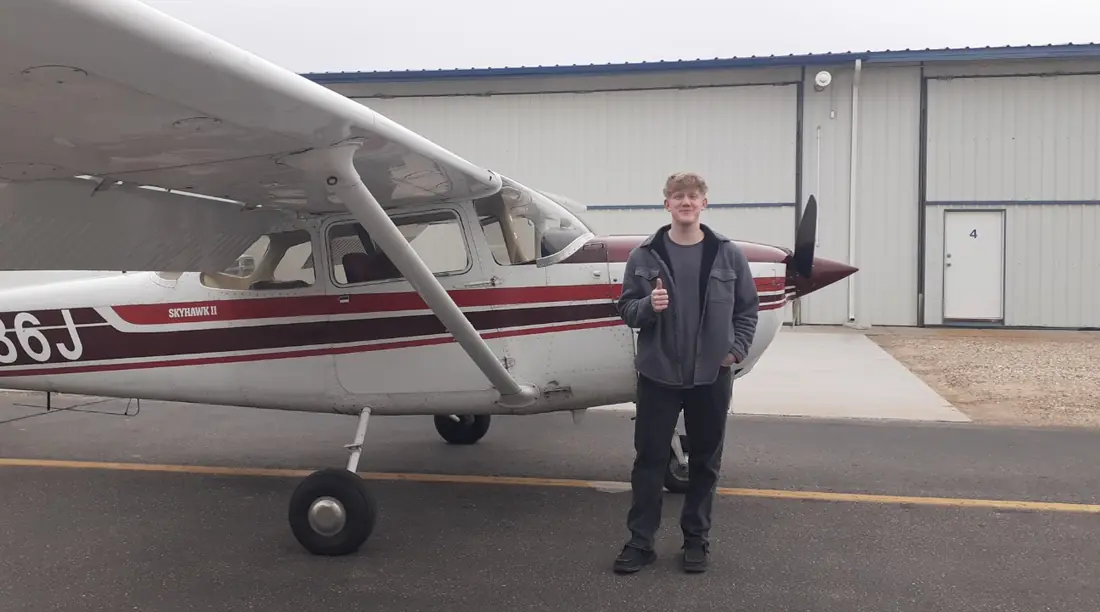 Zacharyah Saulls with Cessna 172 N6486J after his first solo